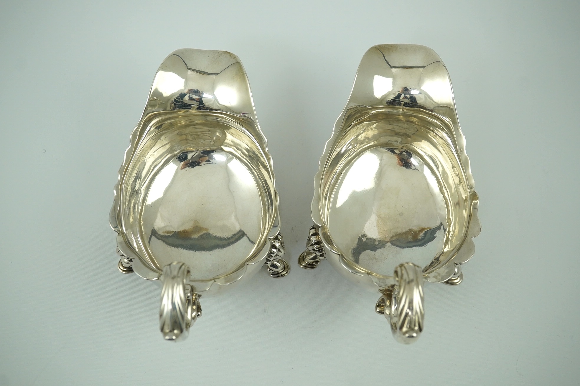 A pair of George II silver sauceboats, by Henry Brind